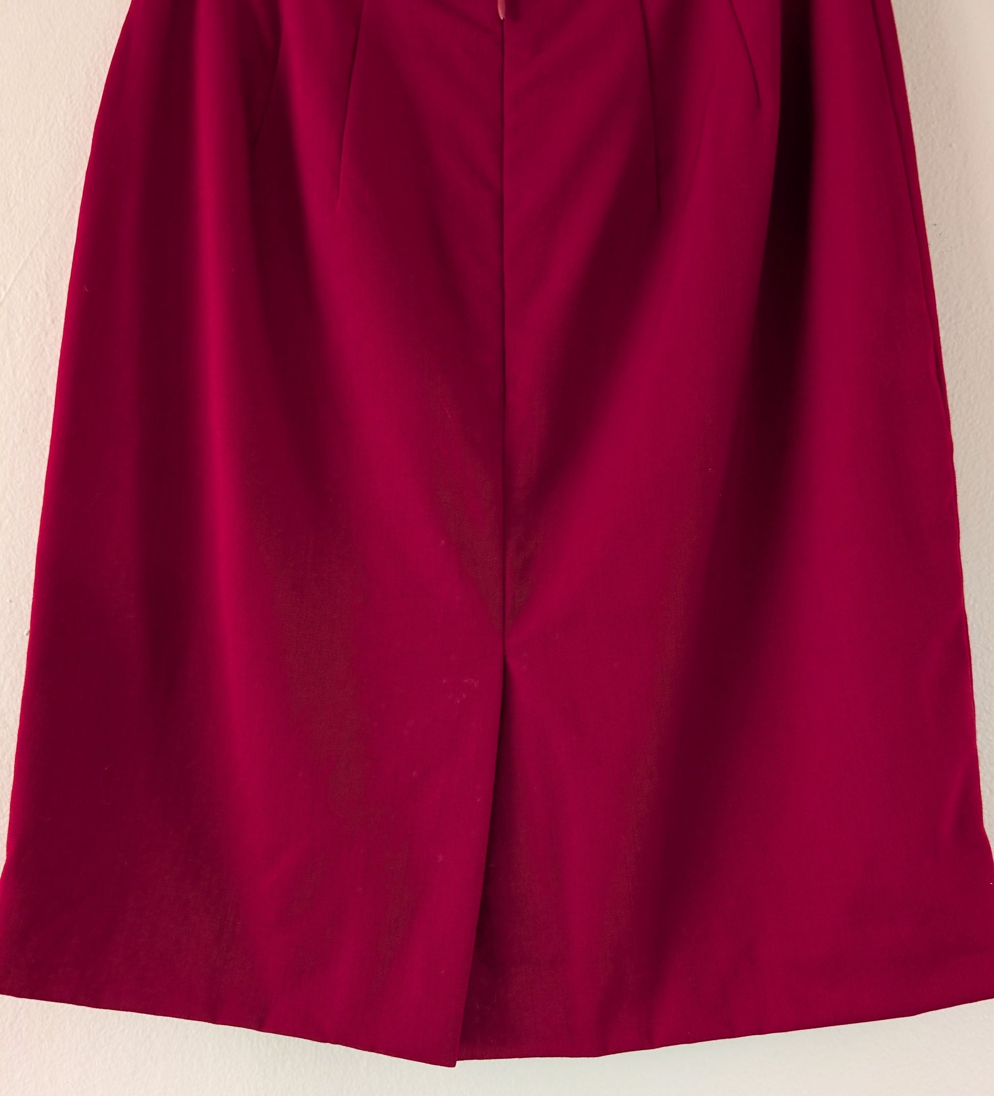 close up of back of red wool skirt
