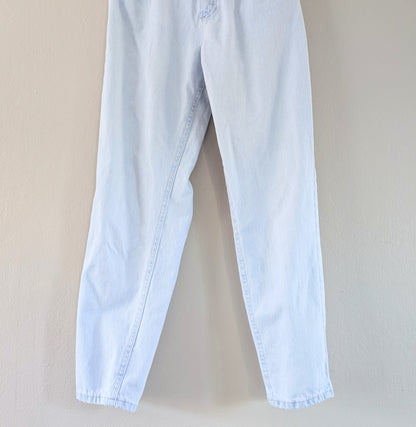 Light blue jeans on a beige background