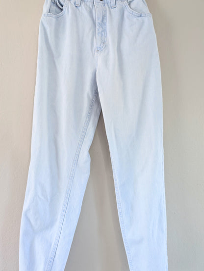 Light blue jeans on a beige background
